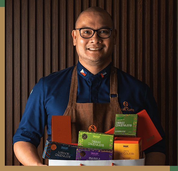 Chef Nouel Catis holding his chocolate collection